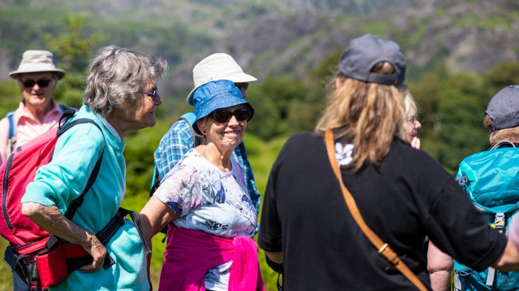 Volunteer showing group of visitors on a guided walk